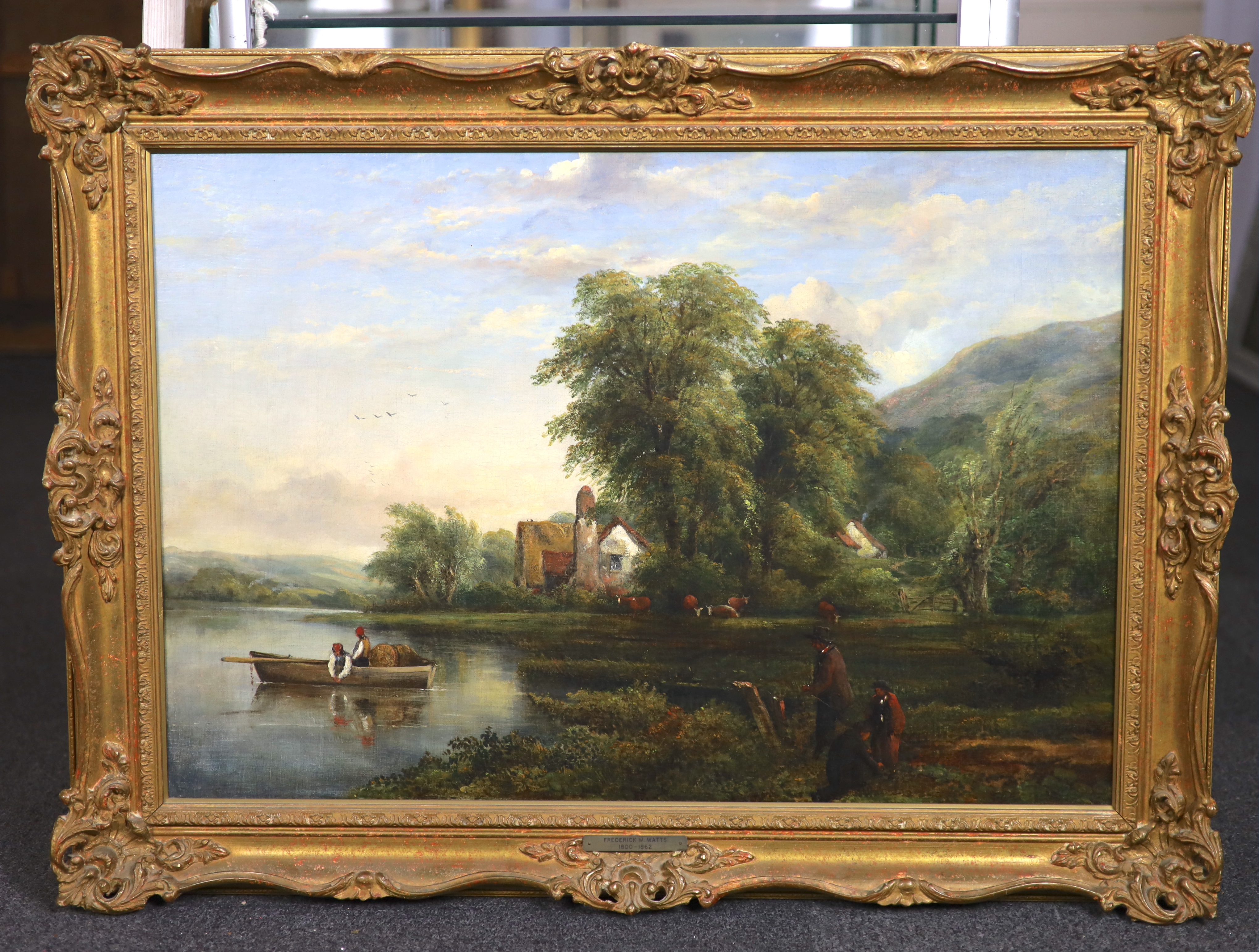 Frederick William Watts (English, 1800-1870), River landscape with fishermen in a boat, onlookers on the bank and cattle beyond, oil on canvas, 50 x 73cm